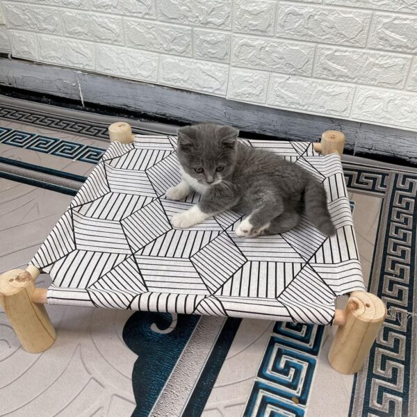 IMG-20250619-WA0031 Purrly Elevated Wooden Cat Bed – Washable Canvas Lounger with Pine Wood Legs (19.6"x19.6")